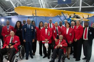 U.S. Air Force Chief of Staff Gen. CQ Brown, Jr., center left, and Tuskegee Airmen stand in front of the PT-17 Stearman during the Tuskegee Airmen PT-17 Stearman Aircraft Exchange ceremony at Joint Base Andrews, Md., July 26, 2023. Generations of Tuskegee Airmen attended the exchange ceremony. (U.S. Air Force photo by Senior Airman Tyrone Thomas)