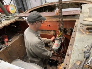 Volunteer Jim Winroth works on the newly fabricated firewall of the M36 Jackson to accommodate the original GAA V-8 engine.